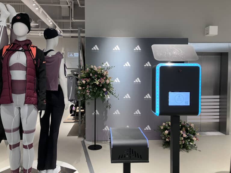 Branded photobooth with custom Adidas step and repeat backdrop at a retail brand activation in Amsterdam - Smilen.nl