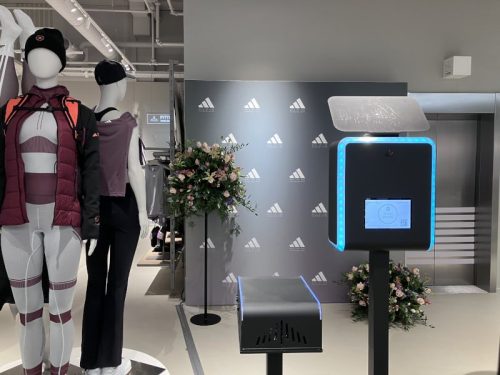 Branded photobooth with custom Adidas step and repeat backdrop at a retail brand activation in Amsterdam - Smilen.nl