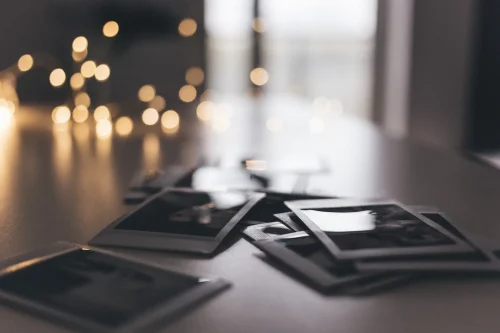 Several Instax photos on a table